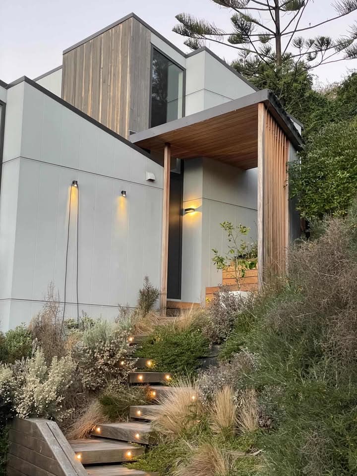 A modern Christchurch home styled for short-stay guests at dusk